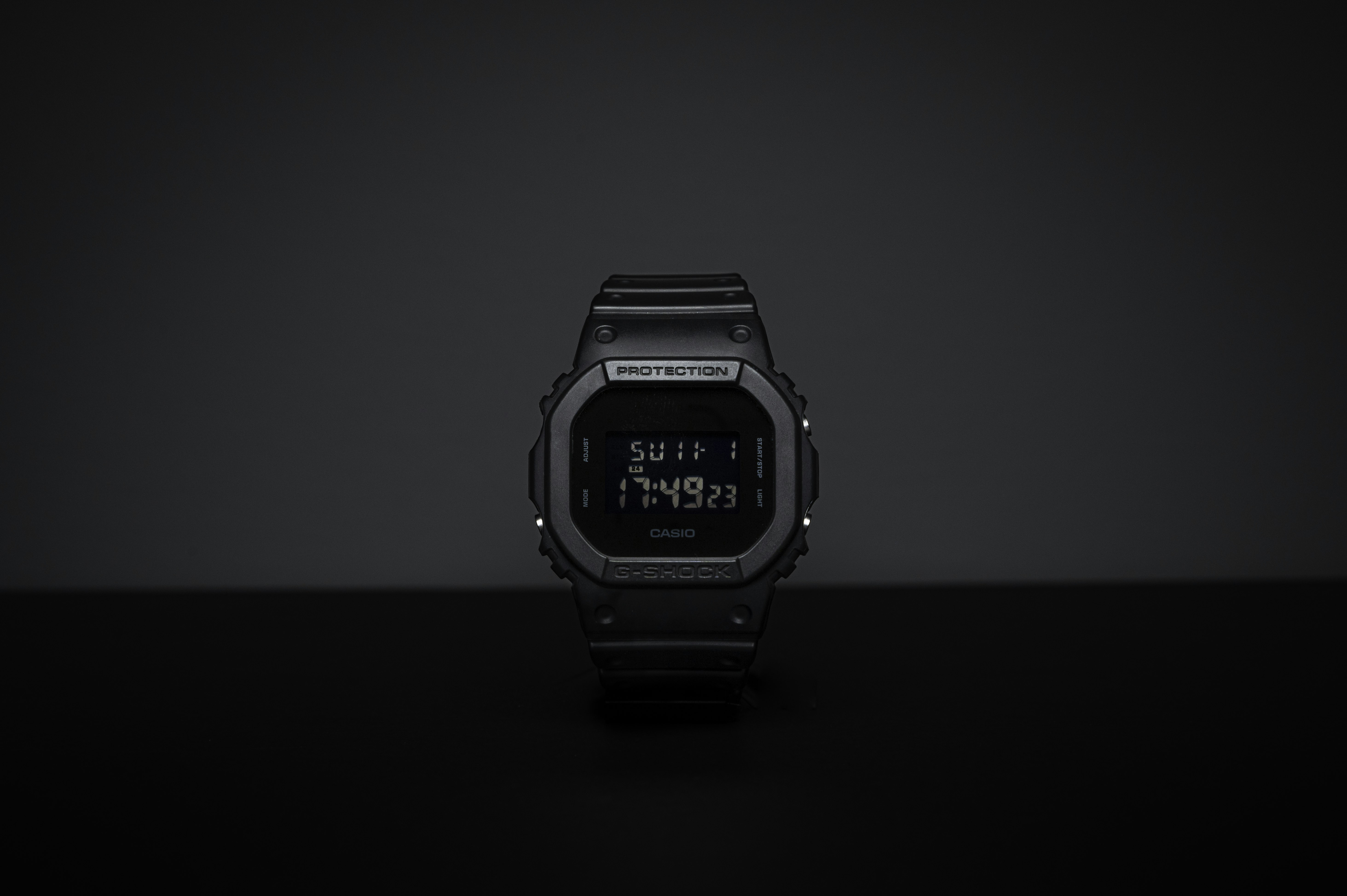 black casio digital watch at 11 00